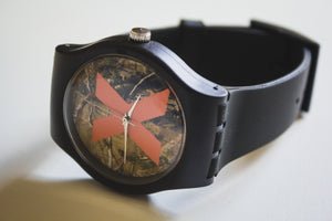 Straight Edge Watch with an orange X and hunting camouflage background pattern, black wristband