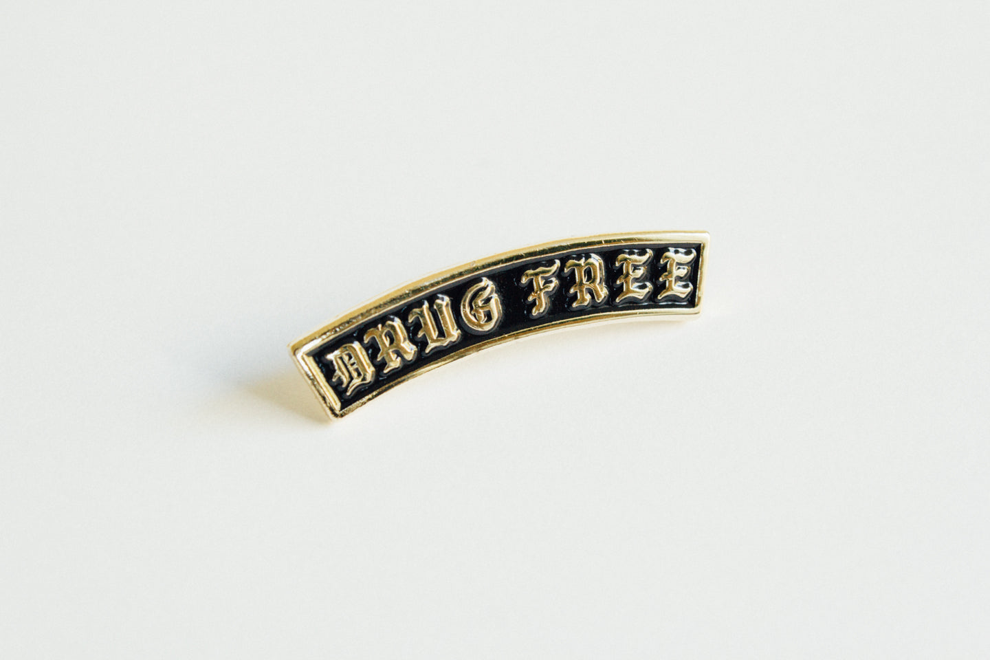 Drug Free Arch Straight Edge Lapel Pin in black and gold by STRAIGHTEDGEWORLDWIDE