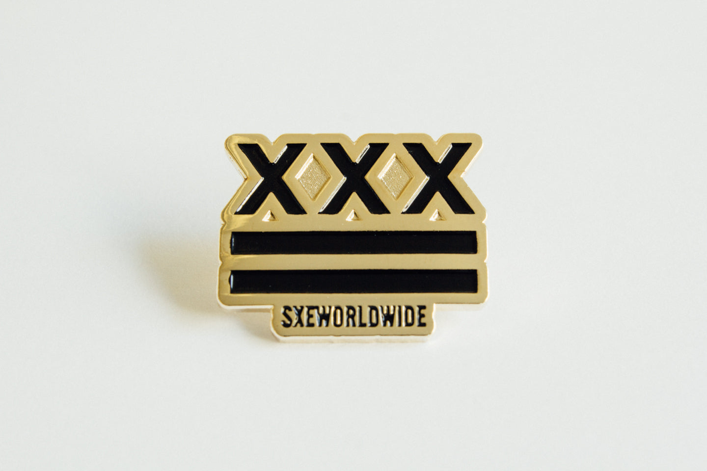 SXE Flag Straight Edge Lapel Pin in black and gold by STRAIGHTEDGEWORLDWIDE